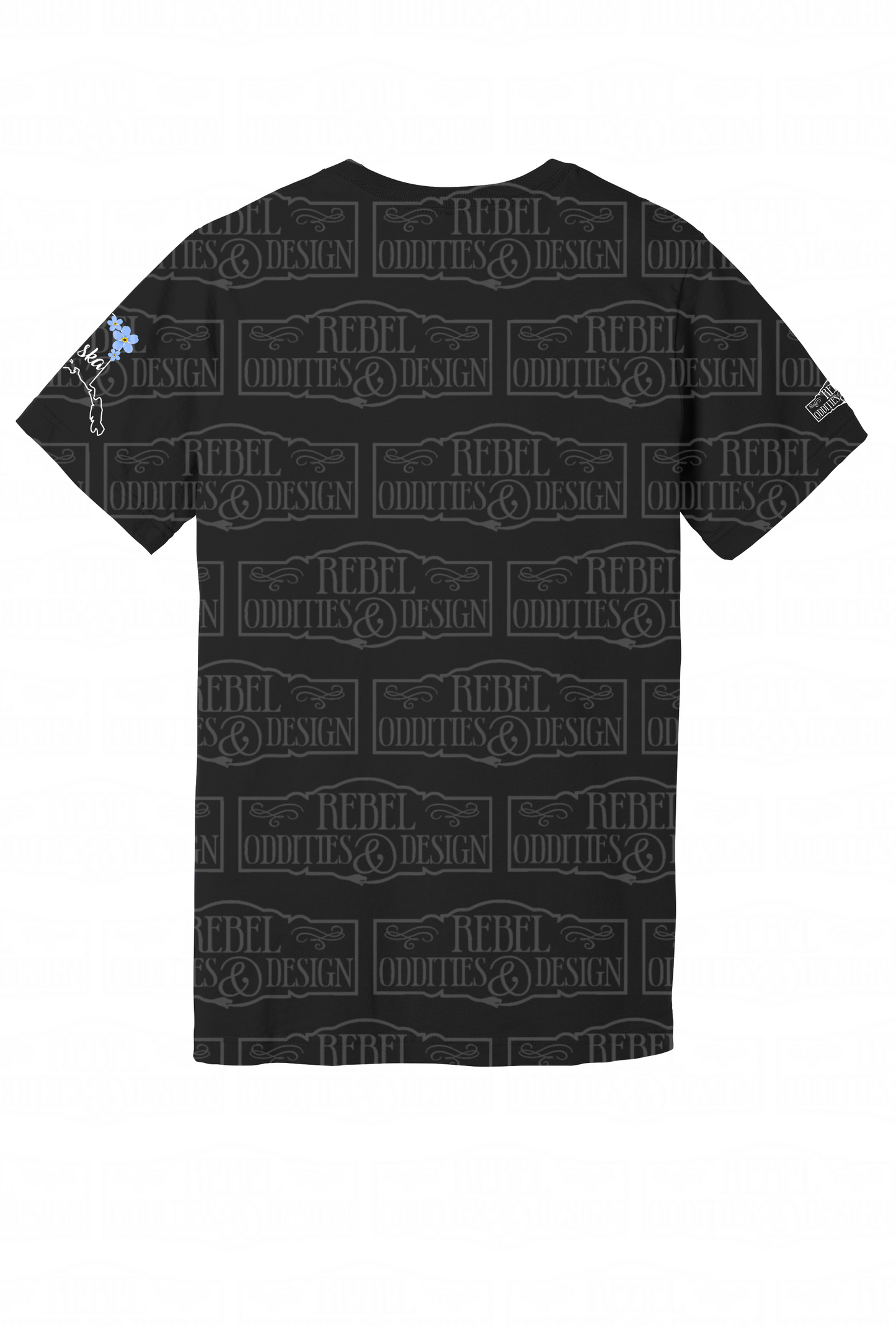 The back of the black t-shirt with the shape of Alaska on the left sleeve, a small logo on the right sleeve, and a Forget-Me-Not and Fireweed design on the front against a white background. There is nothing on the back of the shirt.