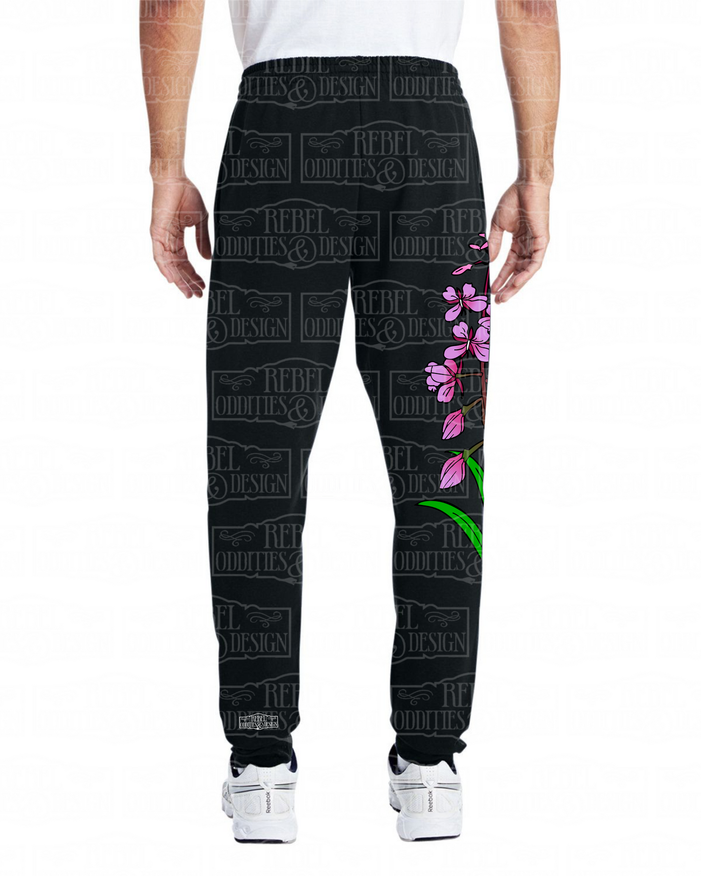 Back view of Black jogger sweatpants with a fireweed design up the side of the right leg, featuring script reading 'Alaska' and three forget-me-nots below the left pocket, along with a small version of the logo on the back of the left leg, all on a white background.