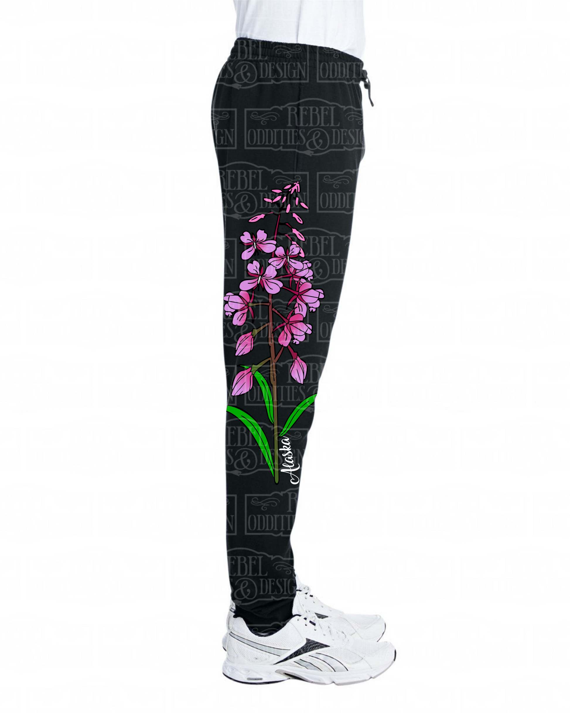 Right side view of Black jogger sweatpants with a fireweed design up the side of the right leg, featuring script reading 'Alaska' and three forget-me-nots below the left pocket, along with a small version of the logo on the back of the left leg, all on a white background.
